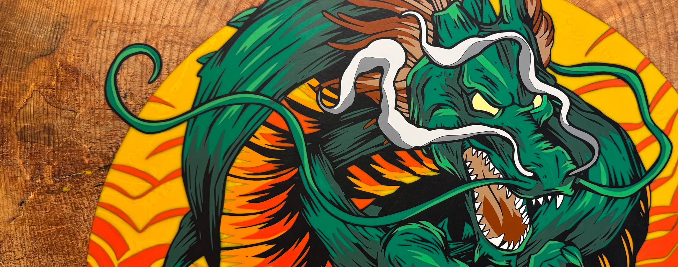 A v-bit resin inlay of a dragon created in Carveco Maker